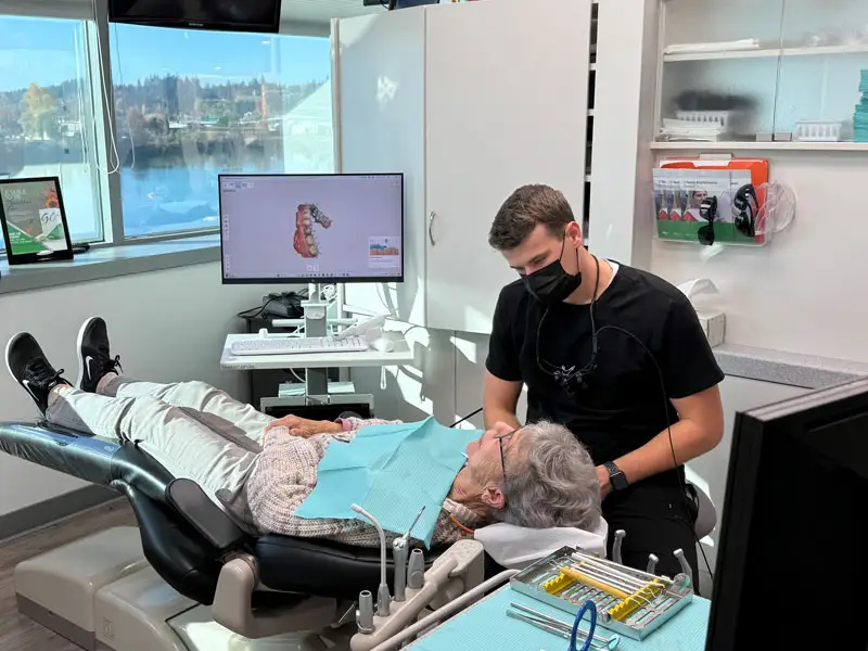 Dr. Andrew Baker, DMD, working with a patient at Lakeview Dental Center.