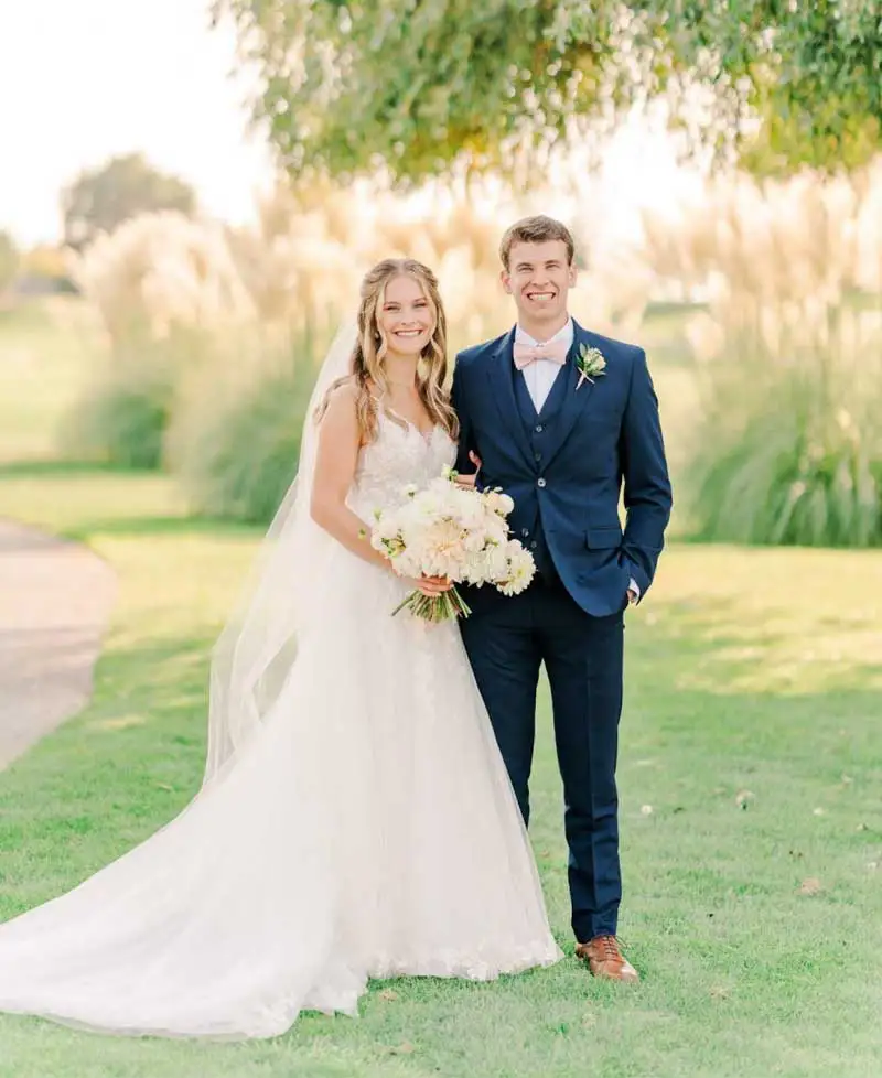 Dr. Andrew Baker, DMD, and his wife wearing a wedding dress at Lakeview Dental Center.