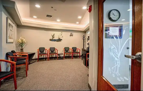 The waiting area with the beautiful glass etched door logo at Lakeview Dental Center 