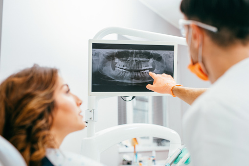 Woman patient discussing digital x-rays with her dentist at Lakeview Dental Center in Salem, OR
